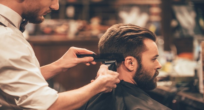 Man getting a haircut at a gents barbershop
