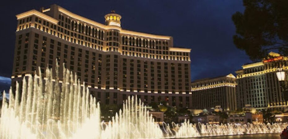 Night view of the Bellagio Las Vegas with its illuminated fountain show in front.
