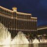 Night view of the Bellagio Las Vegas with its illuminated fountain show in front.